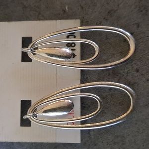 Designer Anne Klein Silvertone clip on silvertone earrimgs.